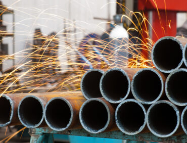 Welder at work. Surrounded by sparks